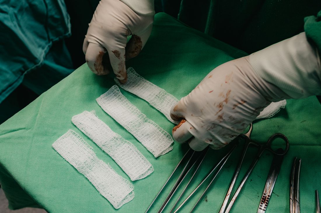 Healthcare professional providing patient wound care