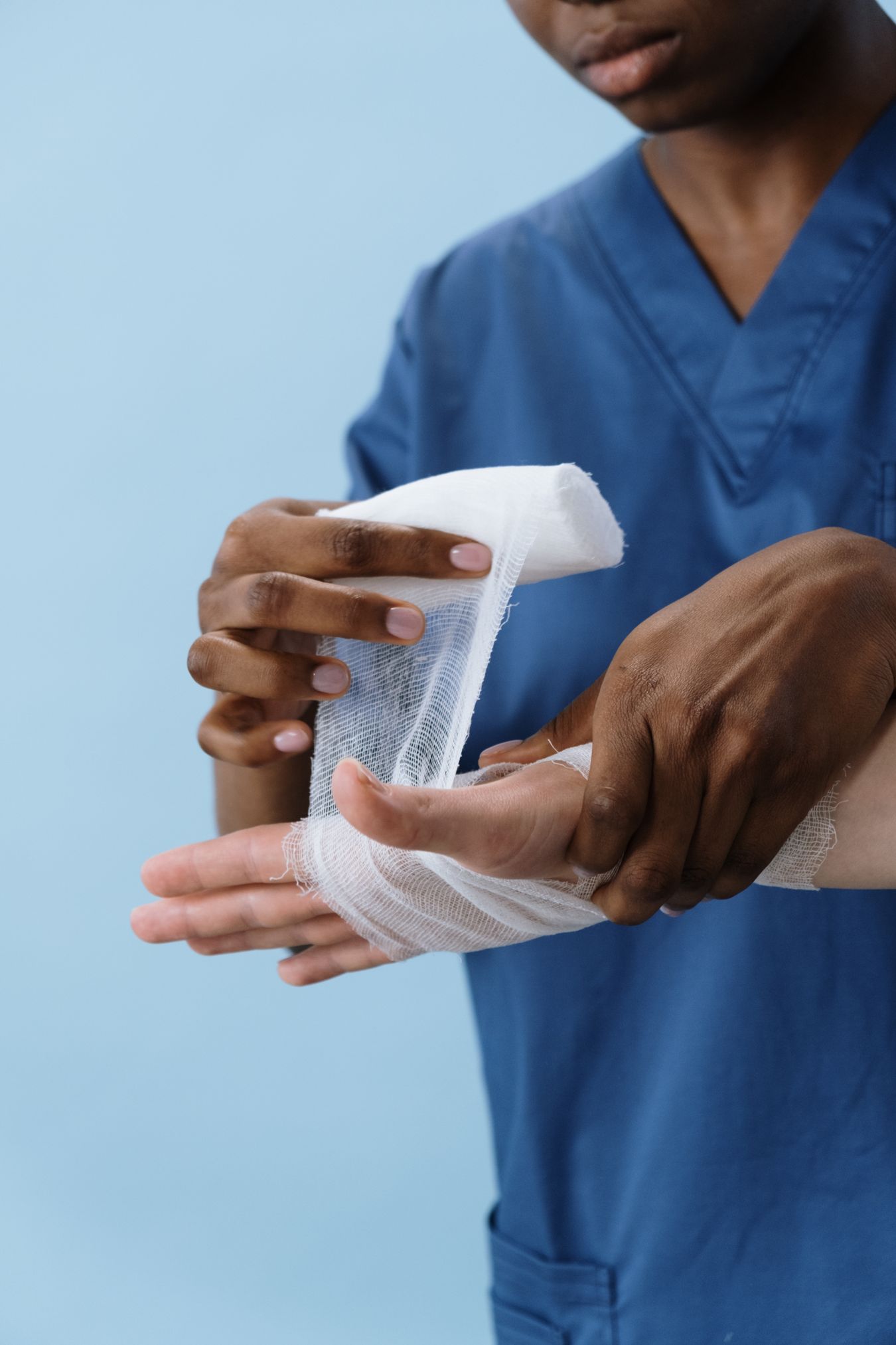 Healthcare professional providing patient wound care