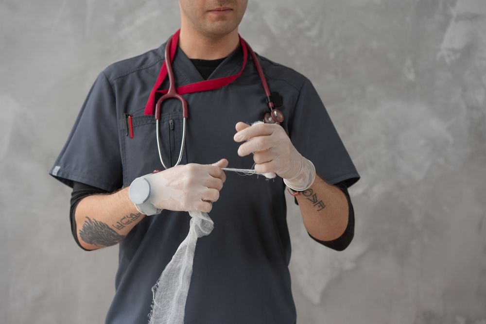 Healthcare professional providing patient wound care