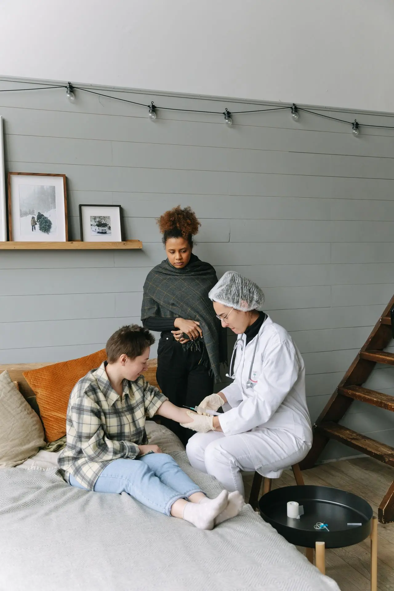 Medical professional providing care during a home visit